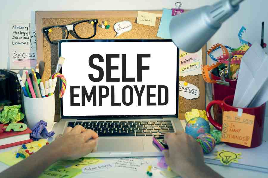 Self employed written on laptop.